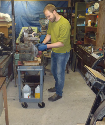 Chris Seiz, working on the Vandercook
                restoration