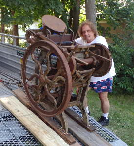 George with "Old Rusty" on the
                  trailer